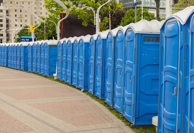 hygienic portable restrooms lined up at a beach party, ensuring guests have access to the necessary facilities while enjoying the sun and sand in Beloit OH